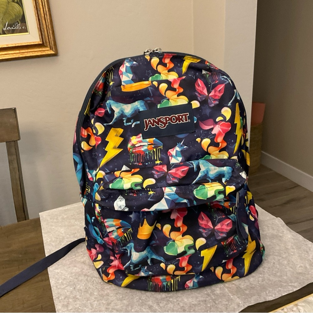 Jansport Blue with various objects Superbreak Backpack
